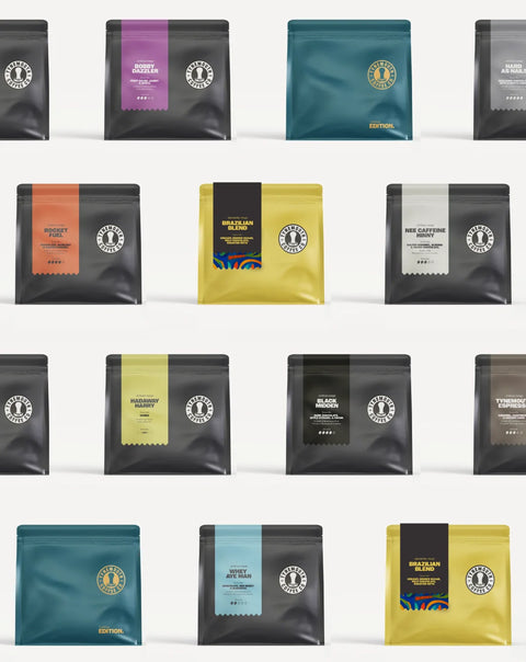 Grid of coffee bags with various colors and designs on a white background